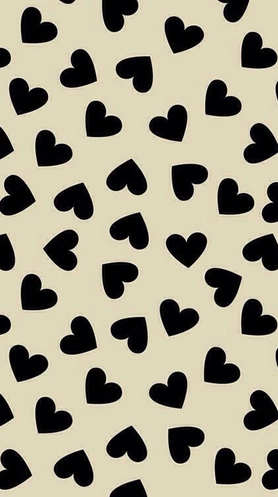 Black hearts on a soft beige background.