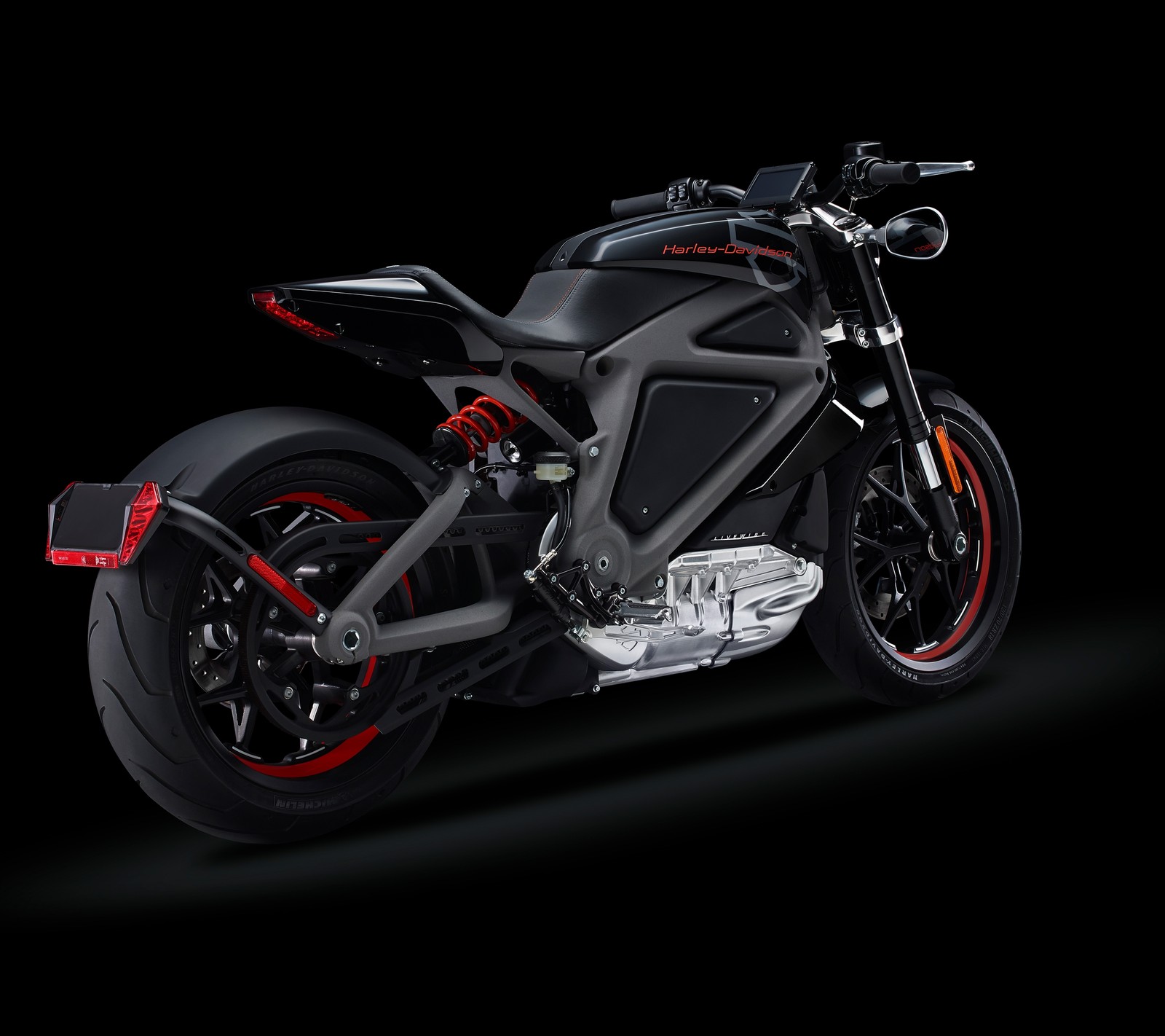 A close up of a motorcycle on a black background with a red stripe (bike, harley, livewire, motorcycle)