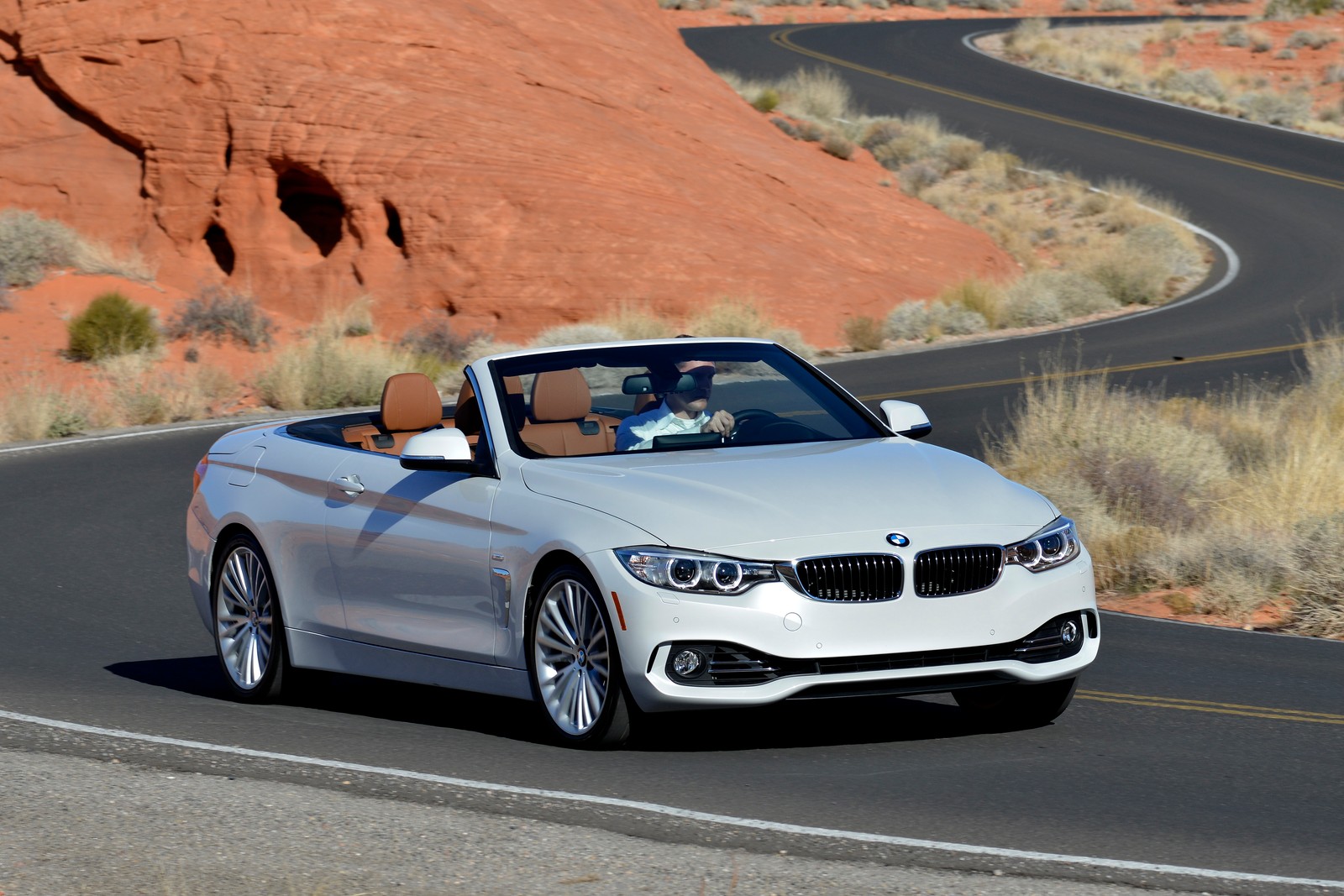 Arafed view of a white convertible car driving down a winding road (bmw, car, bmw 3 series, convertible, bmw 1 series)