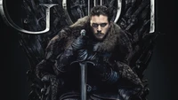 Jon Snow seated on the Iron Throne, exuding a commanding presence and wearing a fur cloak, with a sword resting across his lap.