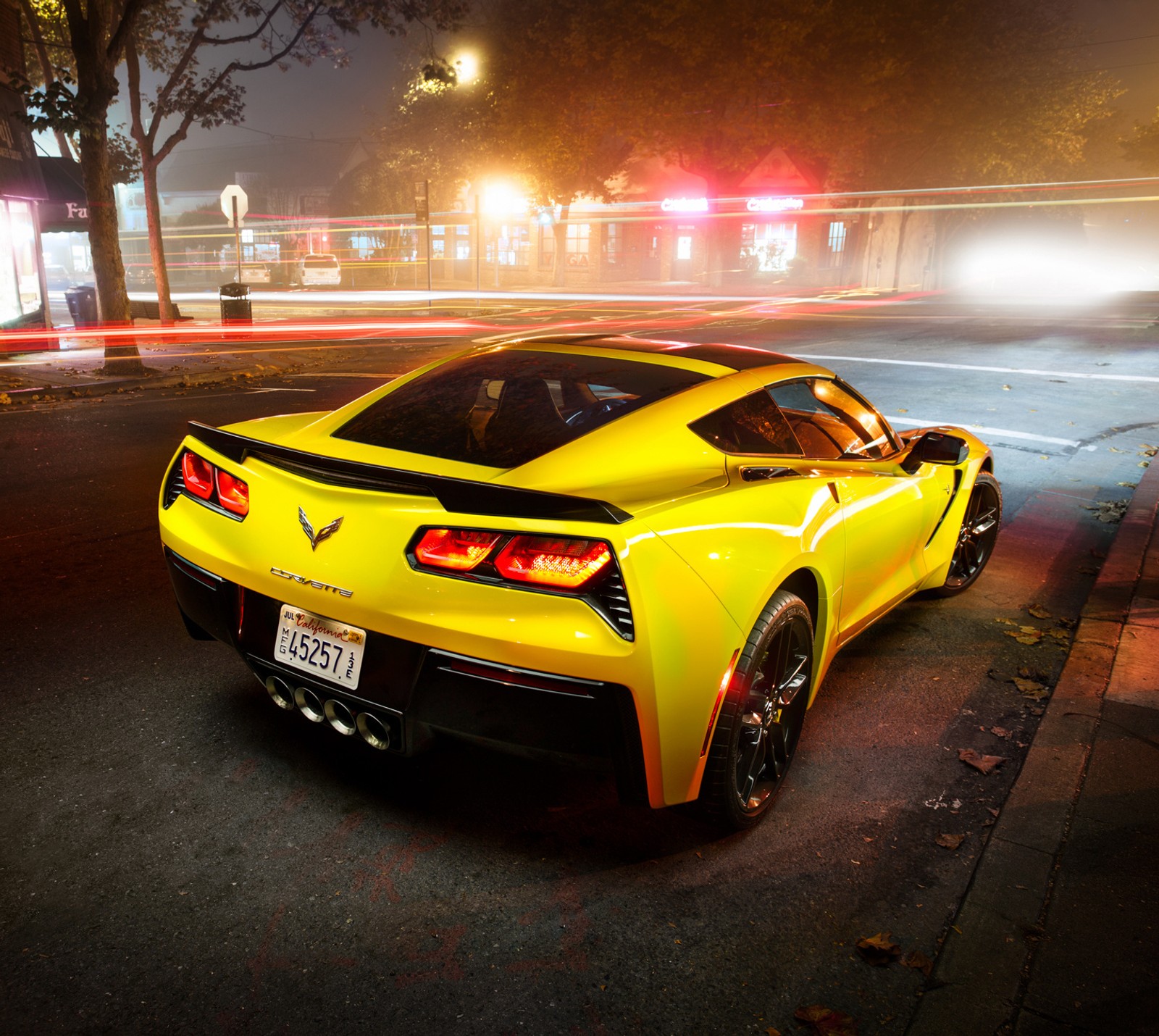 A close up of a yellow sports car parked on a street (audi, bmw, camaro, mercedes, mustang)