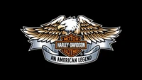 Logo Harley-Davidson avec emblème d'aigle doré et ailes