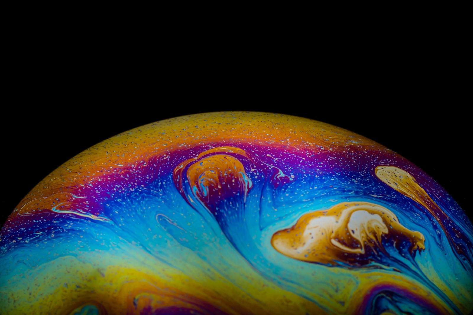 Brightly colored marble ball with a dog in the center (bubble planet, soap bubble, macro, aqua art, colorful)