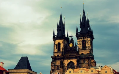 Prague's Astronomical Clock Tower: A Landmark of Medieval Architecture Against a Dramatic Sky.