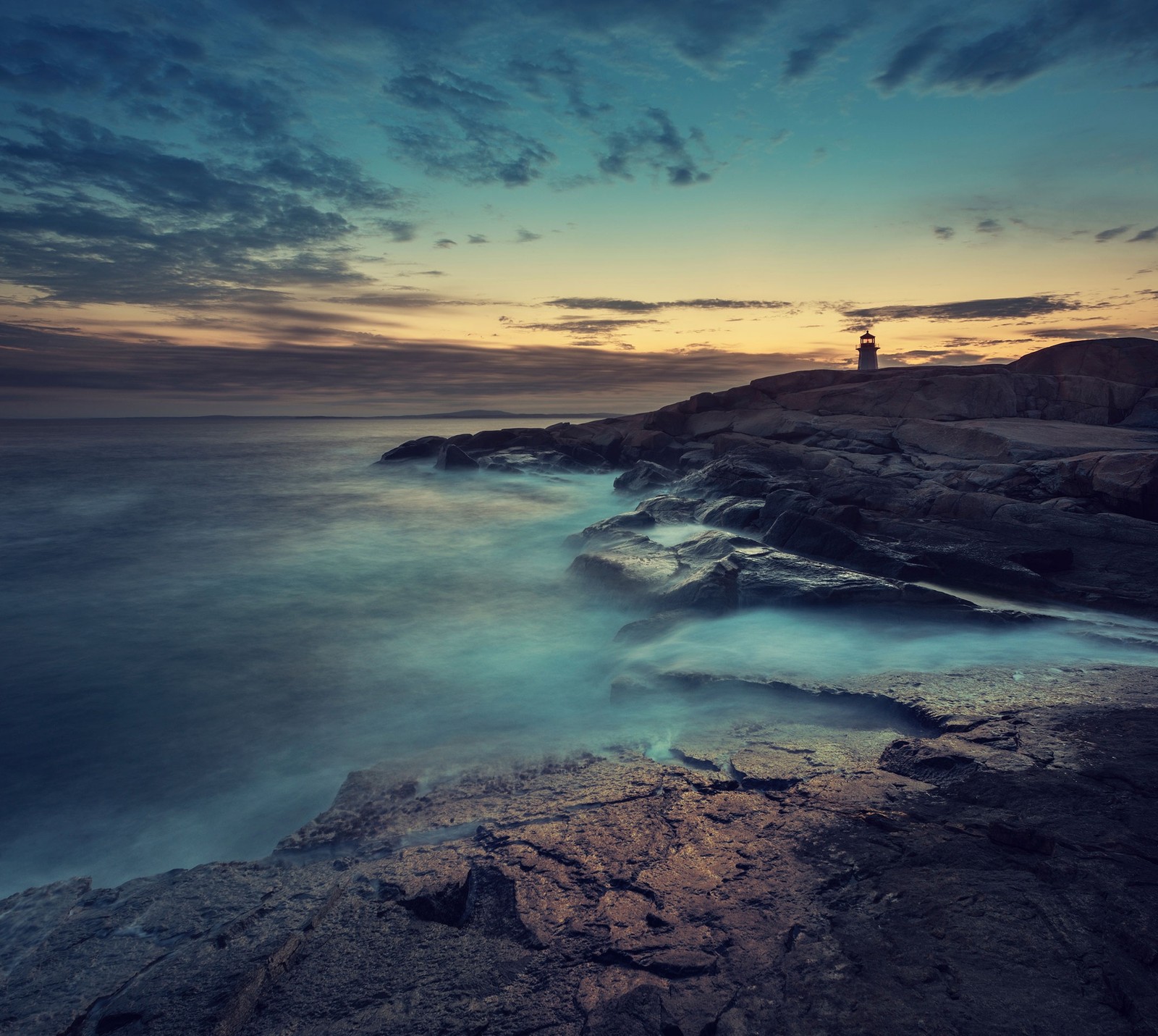 A view of a lighthouse on a rocky shore at sunset (landscape, sony, wallpaper, xperia)