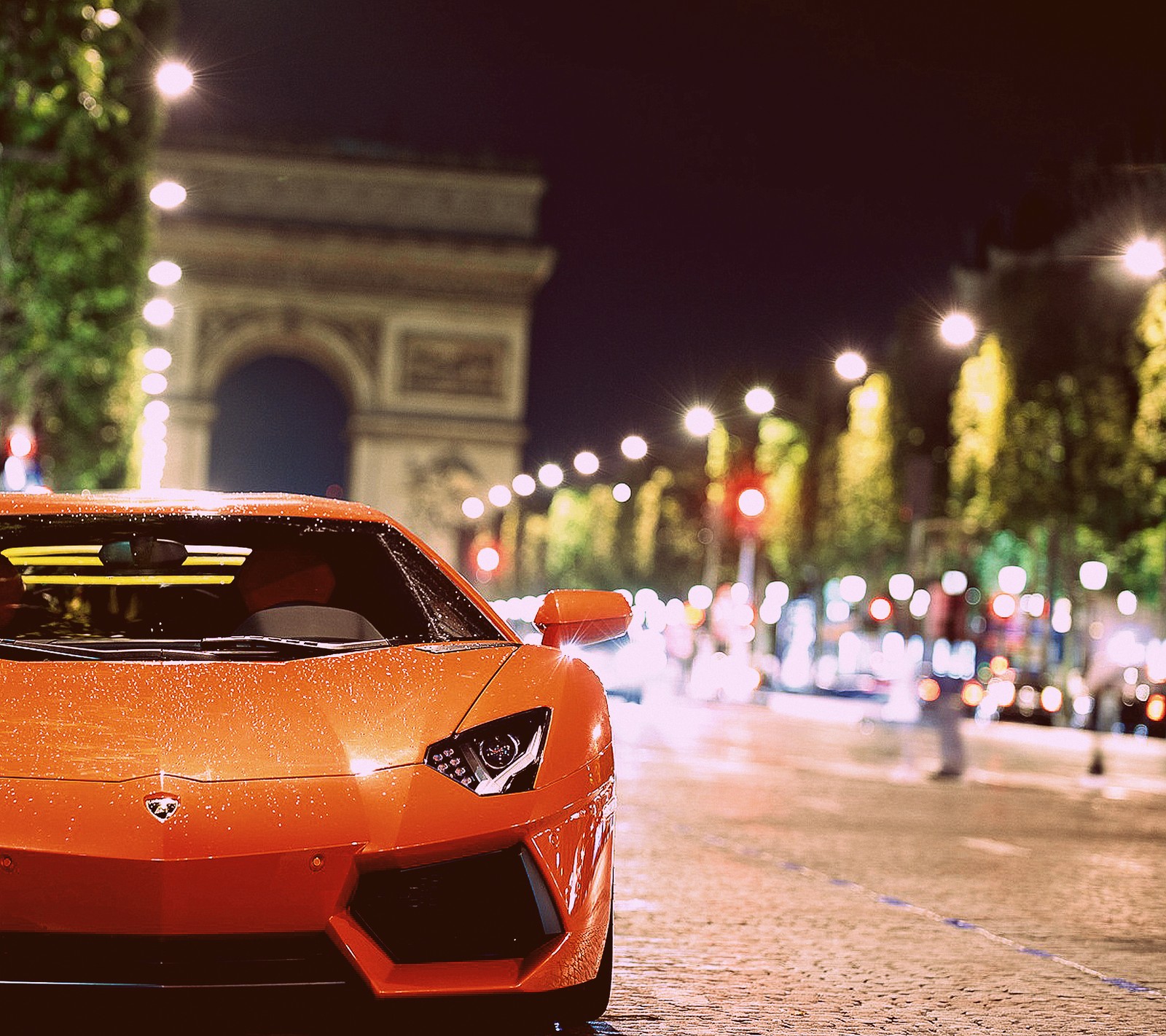 Arafed orange sports car parked on a city street at night (aventador, fast car, lambo, lamborghini, luxury)