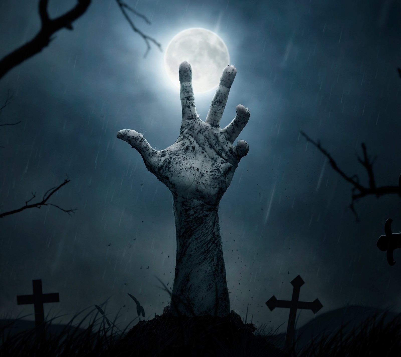 Eine hand, die aus einem grab in einem gruseligen friedhof herausragt (cenmen, zombie)