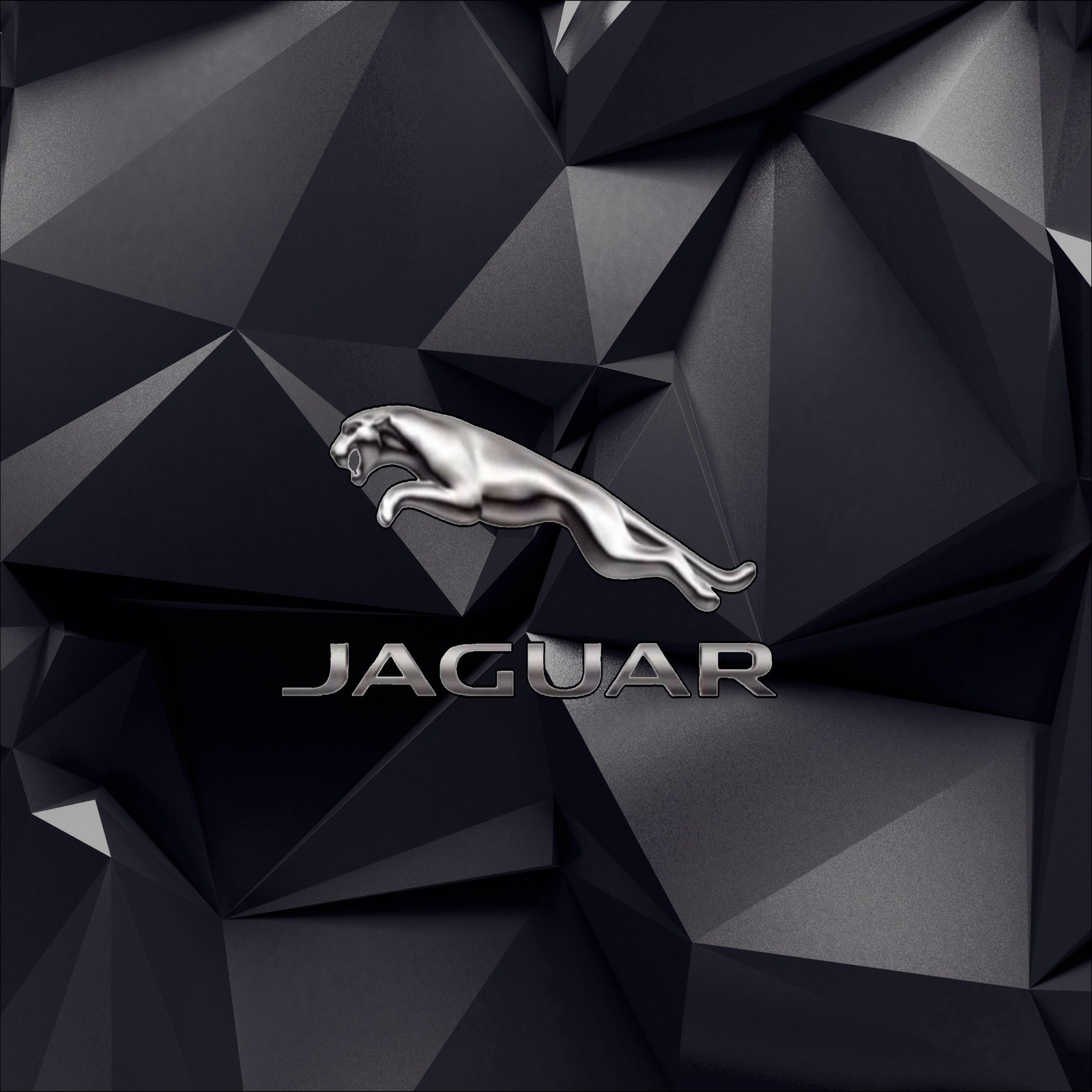 Un gros plan du logo jaguar sur fond noir (voiture, jaguar, logo)