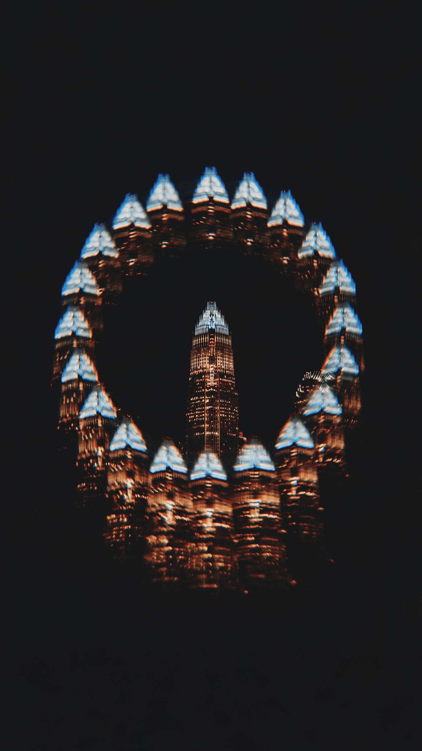 Arafed image of a clock tower in a circle of lights (architecture, symmetry, illustration, arch, darkness)