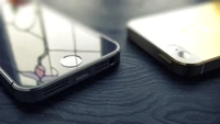 Close-up of Elegant Apple Smartphones on a Wooden Surface