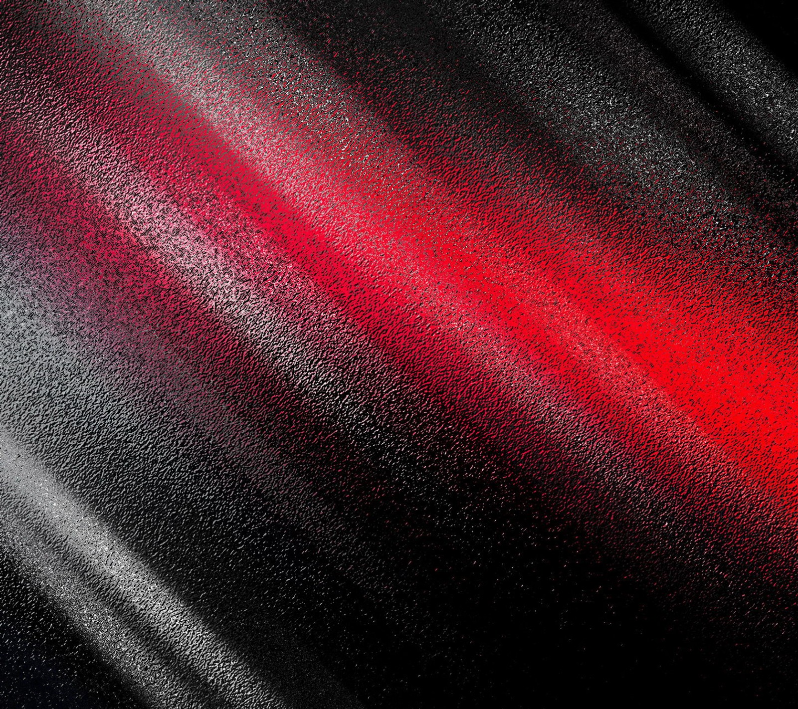 Un primer plano de un fondo rojo y negro con un fondo negro (abstracto, negro, colores, vidrio, rojo)