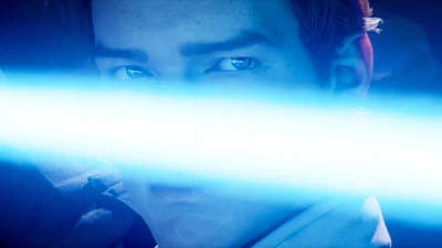 La détermination d'un Jedi illuminée par la lueur d'un sabre laser dans un moment de concentration intense.