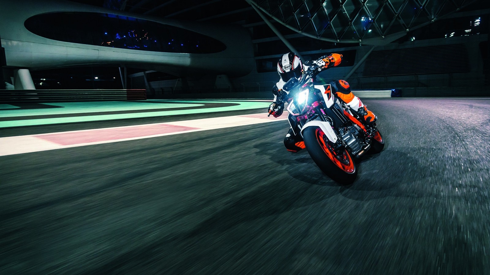 Arafed motorcycle rider riding on a track at night (motorcycle, ktm, race track, ktm 390 duke, racing)