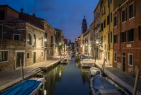 Serene Nighttime Reflections in a Venetian Canal