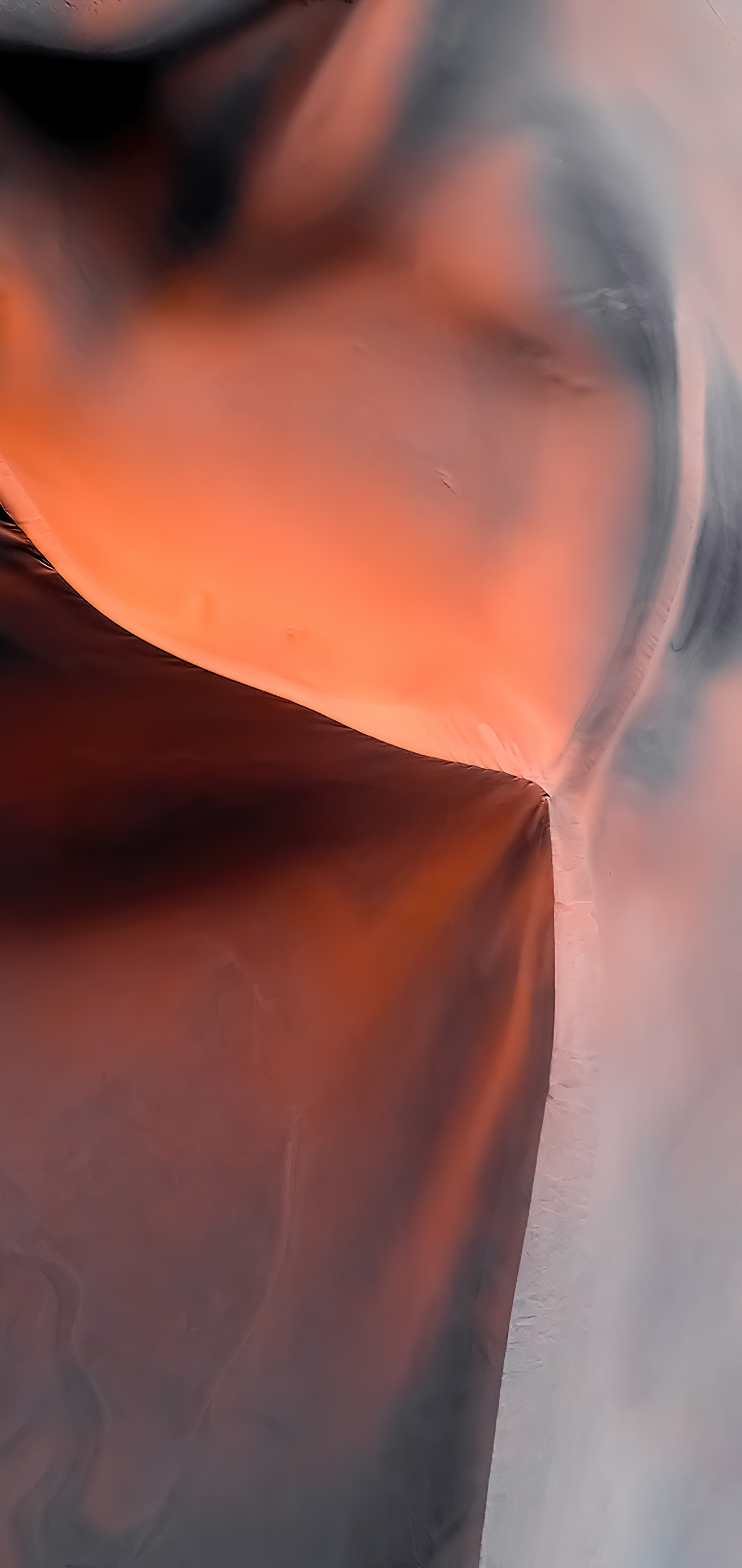 There is a close up of a piece of paper with a red background (woman, visual arts, amber, orange, wood)