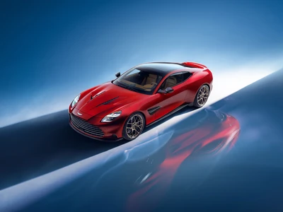 Aston Martin Vanquish : Superbe voiture de sport rouge sous une lumière dynamique