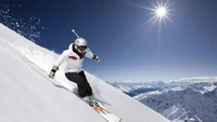 Skier carving through fresh powder on a sunlit alpine slope