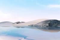 Serene Desert Landscape with Ice Blue Lake and Clear Sky