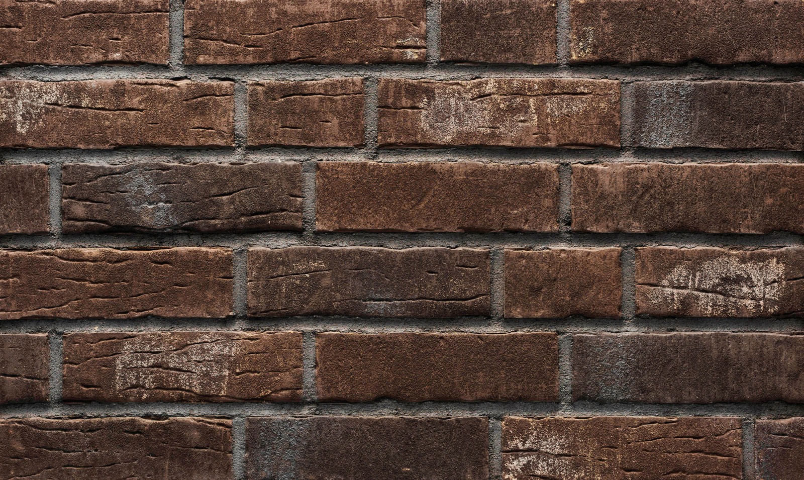 A close up of a brick wall with a brown and black pattern (brickwork, tile, brick, wall, facade)