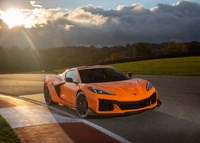 2023 Chevrolet Corvette Z06 with Z07 Performance Package on the racetrack at sunset.