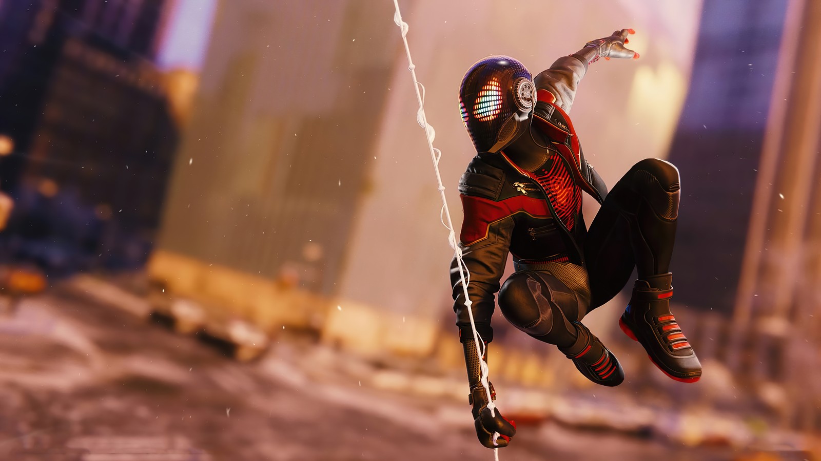 Homme araignée en costume noir suspendu la tête en bas (marvels spider man miles morales, playstation 5, ps5, ps4, jeu vidéo)