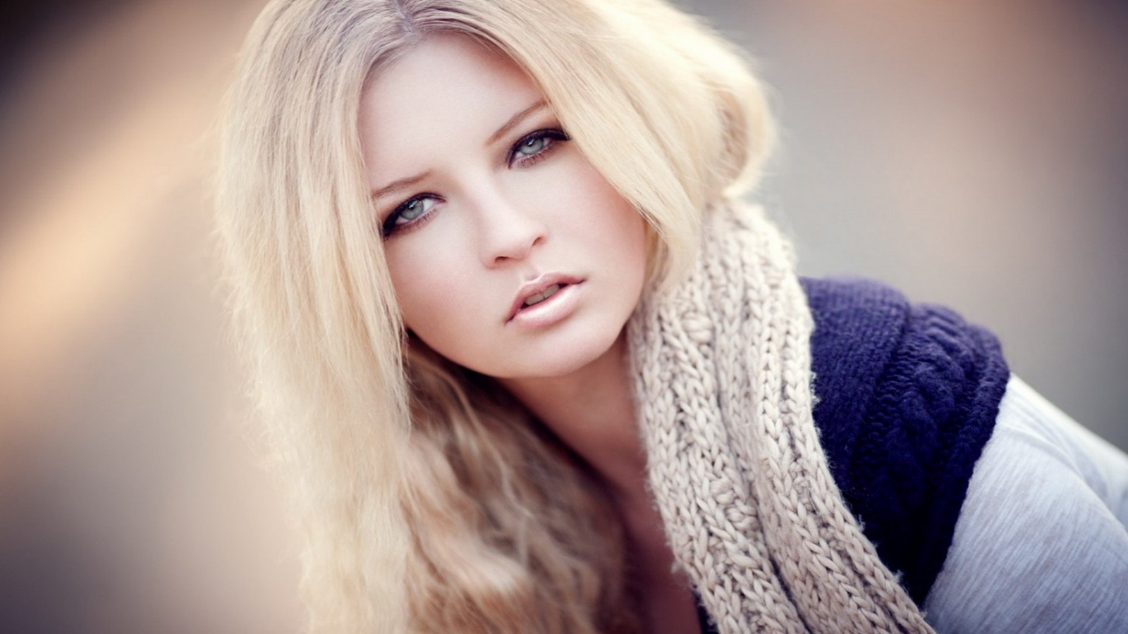 Blond woman with scarf and blue eyes looking at camera (nose, skin, lip, eyebrow, eye)