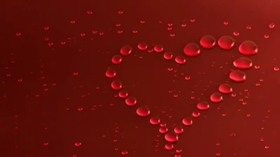 Gotas de agua en forma de corazón rojas que simbolizan el amor