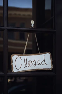 Closed Sign Hangs in Glass Window of Los Angeles Architecture