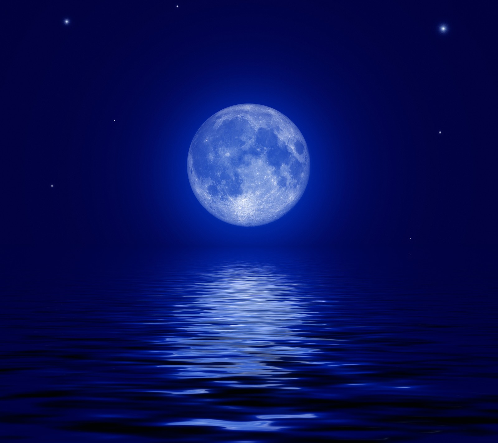 A full moon is reflected in the water at night (lunar, moon, night, ocean, sea)