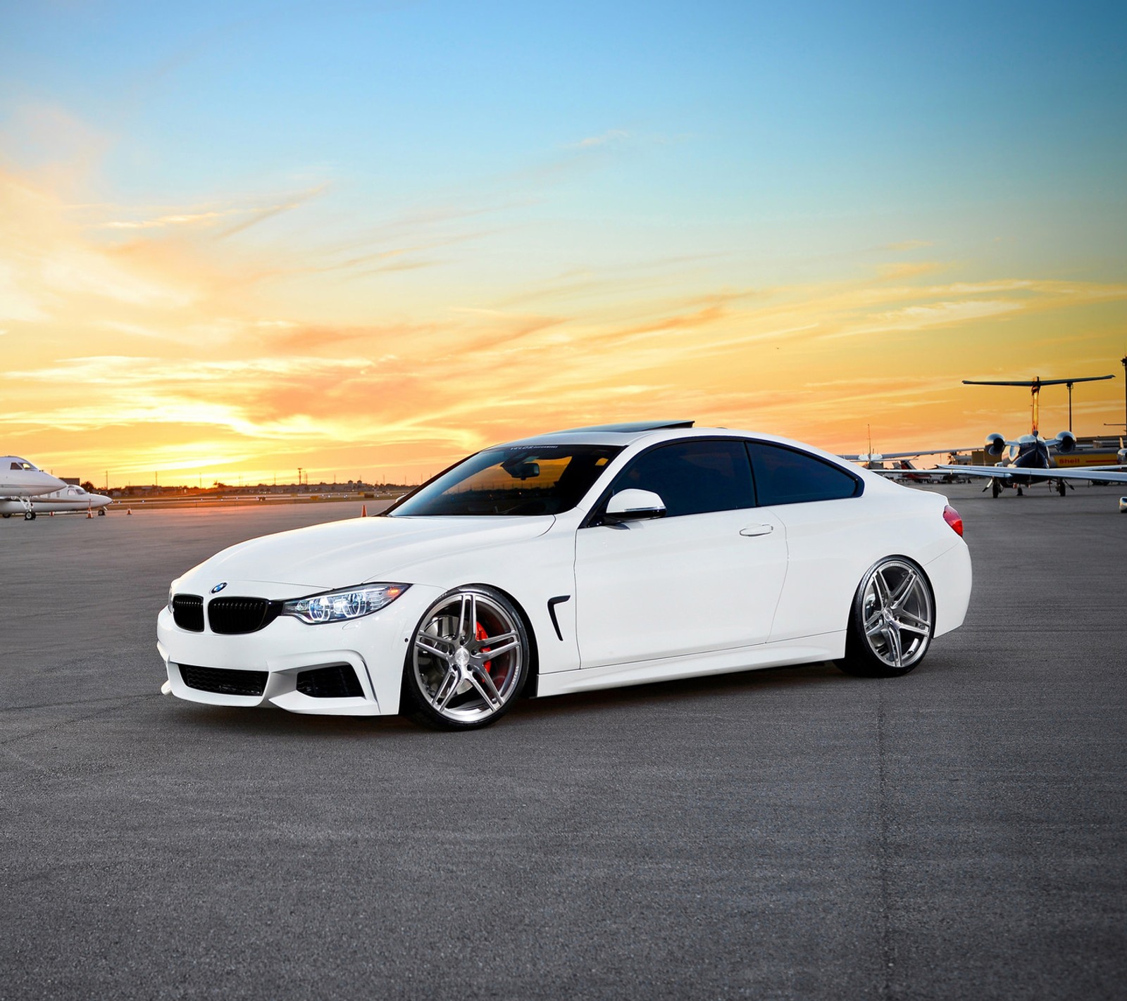 Arafed white bmw car parked on tarmac with airplane in background (4 series, 435i, bmw, coupe, m sport)