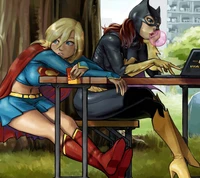 Superheroes Unplugged: Batgirl and Supergirl in a Relaxed Moment