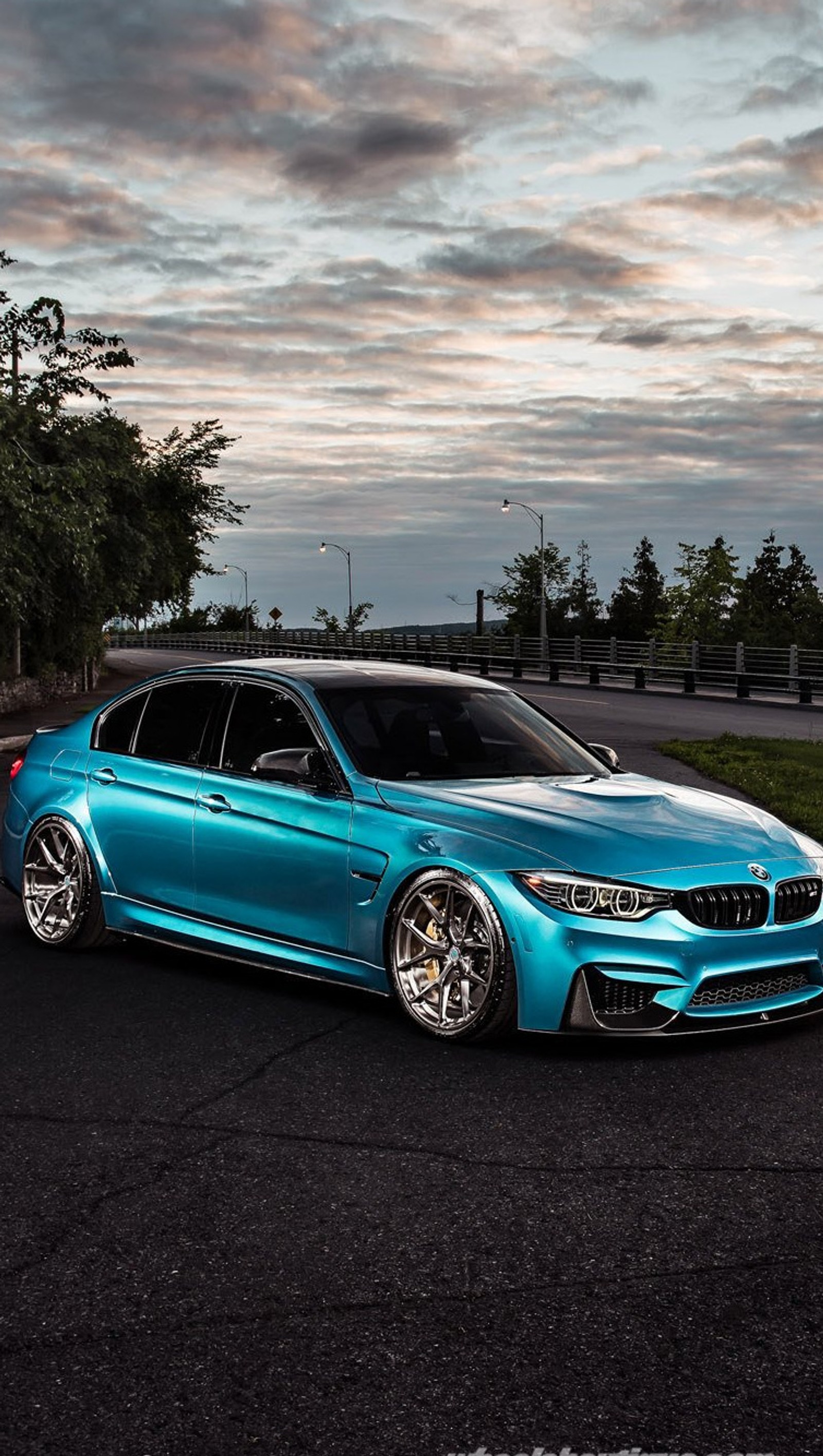 A close up of a blue bmw car parked on a road (bmw, car, color, m3)