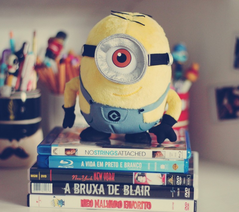 A close up of a stuffed toy on top of a stack of books (etheth, rewh)