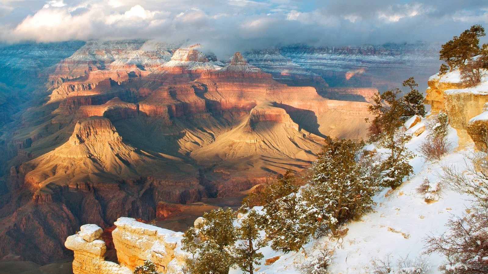 Araffe view of a snowy canyon with a few clouds (bryce canyon national park, national park, mountain, winter, rock)