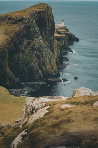 Scenic Cliffs of a Coastal Headland with Lighthouse Overlooking the Sea