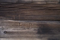 Textured Hardwood Plank with Rustic Stain and Grain Patterns