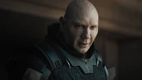 Dave Bautista as Glossu Rabban in Dune, showcasing a powerful and intense expression.