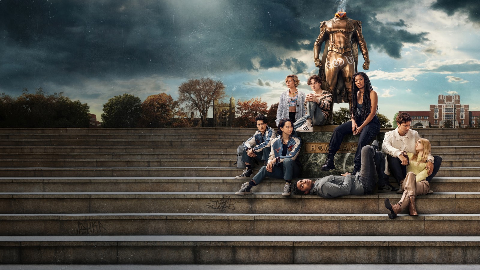 Un grupo de personas sentadas en los escalones frente a una estatua (gen v, series de televisión, reparto)