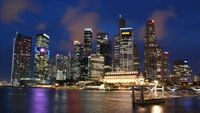 Impresionante horizonte nocturno de la metrópoli de Singapur con reflejos