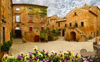 Charmante place médiévale du village avec des fleurs vibrantes et des maisons rustiques