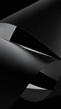 Monochrome Elegance: Curved Black Shapes on a Dark Background