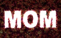 Glowing 'MOM' Text Against a Floral Rose Background for Mother's Day