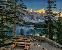 Serene Winter Landscape with a Scenic Bench Overlooking Snow-Capped Mountains