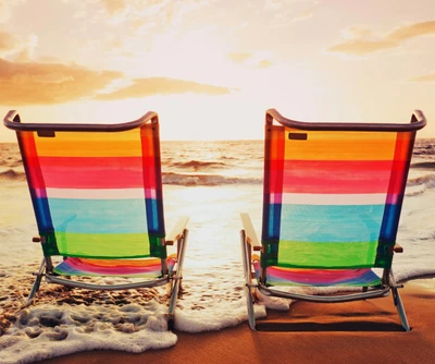 Vibrant Beach Chairs by the Sea at Sunset