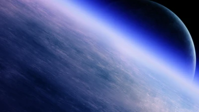 Vast Blue Atmosphere of an Exoplanet in Outer Space