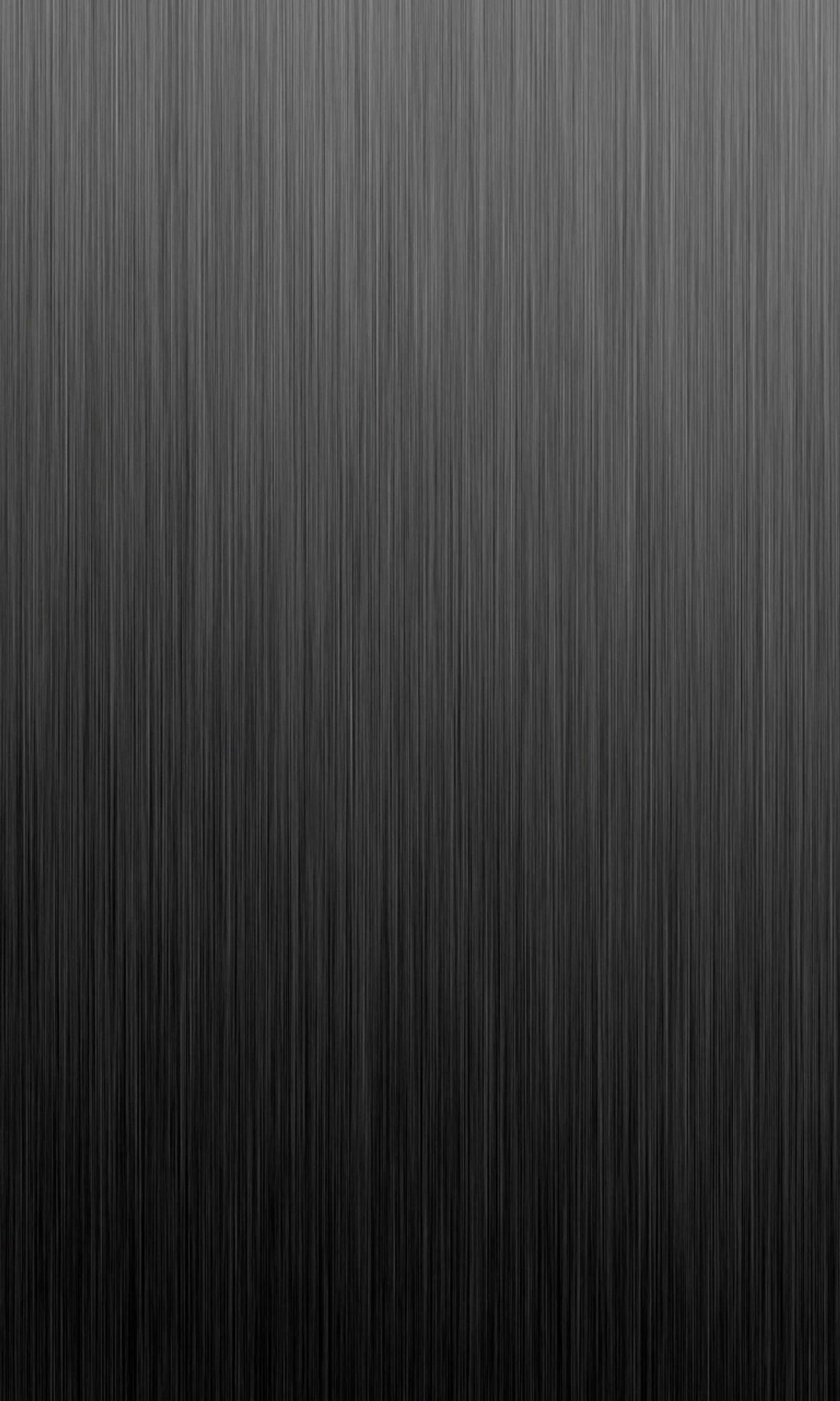 A black and white photo of a metal surface with a black background (metal wallpaper, nice)