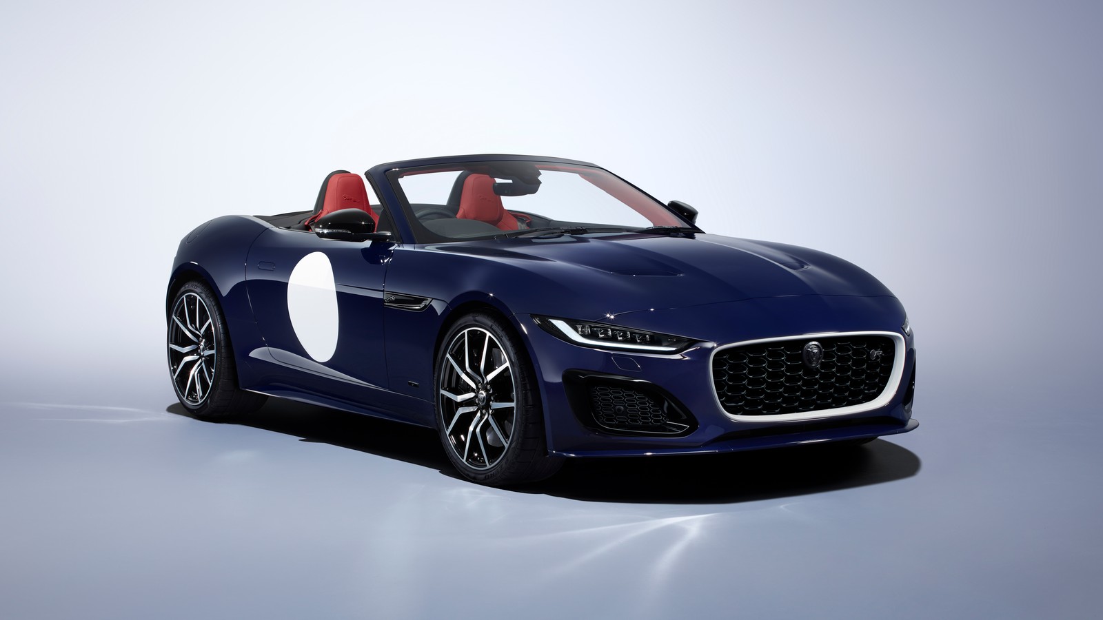 The jaguar car is shown in a studio setting (jaguar f type, convertible, 2023, 5k, 8k)