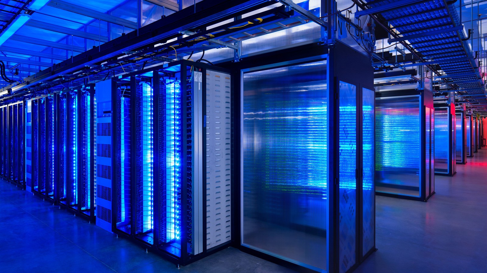 A large room with many rows of servers in it (blue, light, lighting, technology, metropolis)