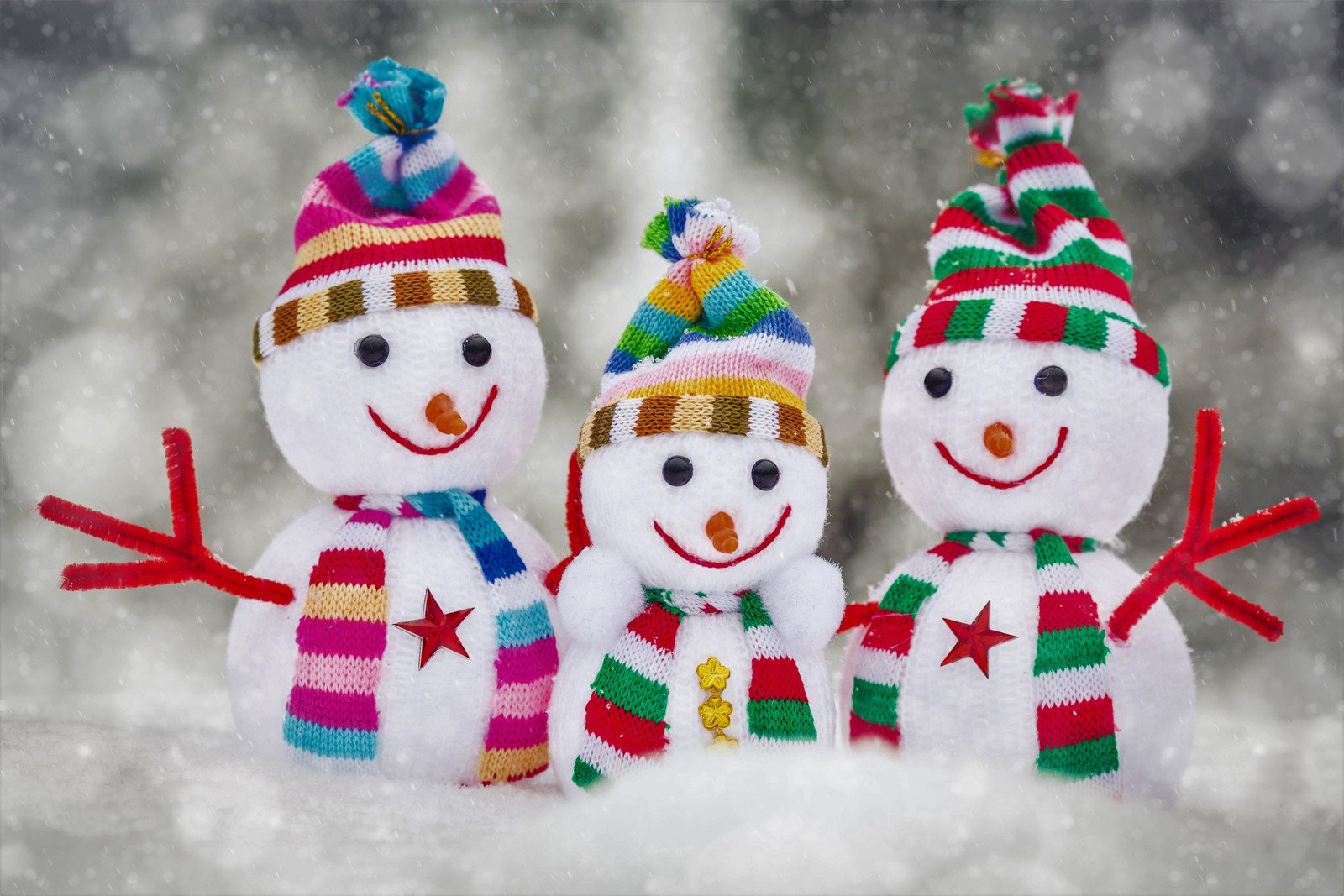 Three snowmen are standing in the snow wearing hats and scarves (abej, beograd, holiday, snowman, winter)