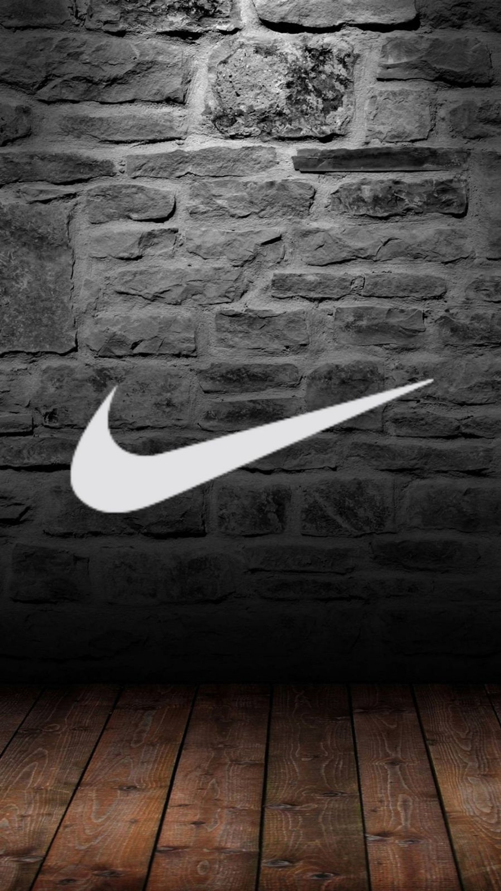 Un gros plan d'un mur en briques avec un logo nike blanc (éditer, amusement, nike, officiel, original)